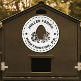 Wooden coop with 'Miller Farms Huntington, PA' logo on a blurred natural background