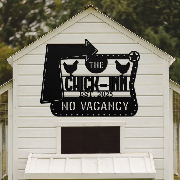 White chicken coop with a decorative metal sign on the side.