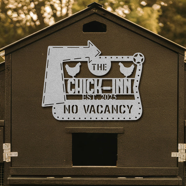Brown chicken coop with a decorative metal sign featuring 'The Chick Inn' and 'No Vacancy'.