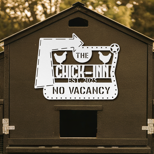 Chicken coop with 'The Chick Inn' sign on a blurred natural background