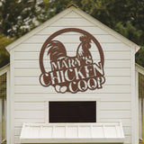 White chicken coop with a rooster logo and 'Mary's Chicken Coop' text on a wooden background.