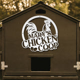 Chicken coop with a decorative rooster logo and 'Mary's Chicken Coop' text.