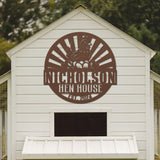 White chicken coop with 'Nicholson Hen House' logo on a wooden panel
