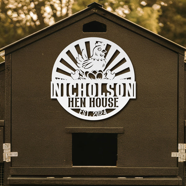 Brown hen house with 'Nicholson Hen House' logo on a blurred natural background