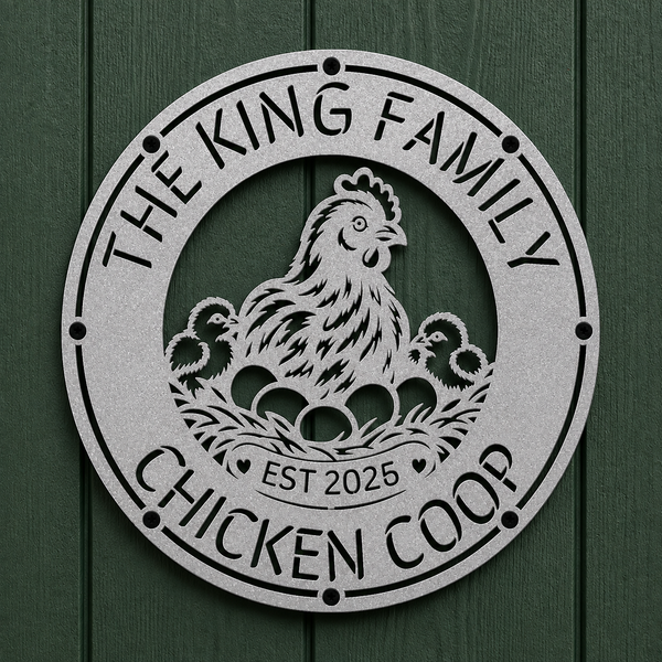 A round metal garden sign featuring a chicken and two chicks with eggs in a nest, surrounded by the text 'THE KING FAMILY CHICKEN COOP' and 'EST 2025'. The sign is mounted on a dark green wood-paneled wall.