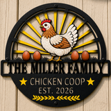 A custom black metal wall sign for a chicken coop, featuring a detailed illustration of a brown and white hen with four brown eggs behind her on a yellow sunburst background. The sign is personalized with the text 'THE MILLER FAMILY CHICKEN COOP EST.