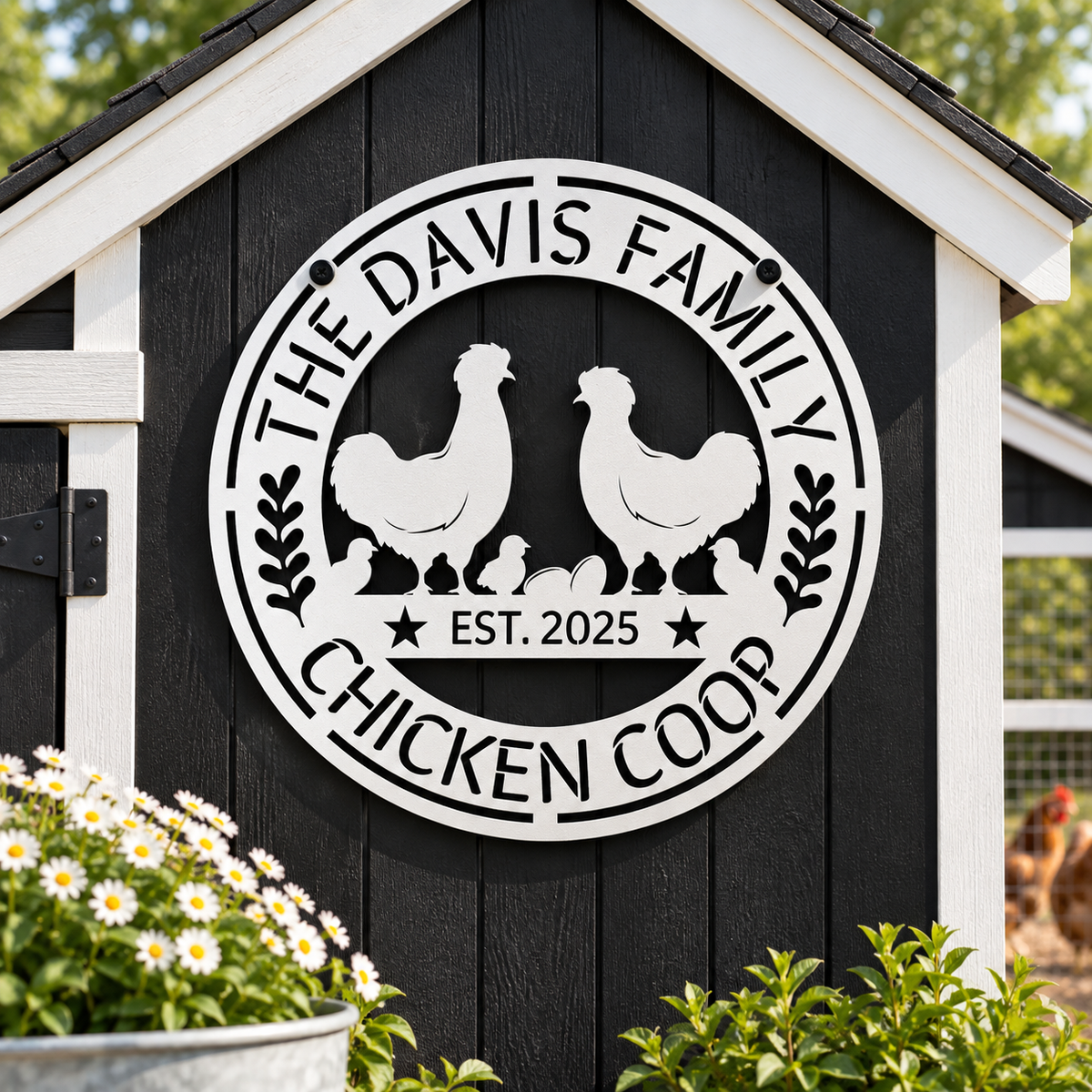 A circular black metal sign mounted on a black wooden chicken coop door, featuring white silhouettes of two chickens, several chicks, and the text 'THE DAVIS FAMILY CHICKEN COOP' and 'EST. 2025'.