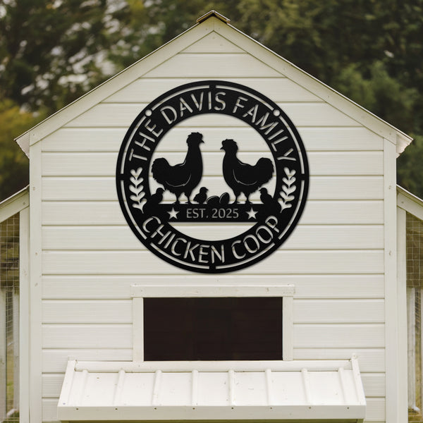 White chicken coop with 'The Davis Family Chicken Coop' sign on a blurred green background