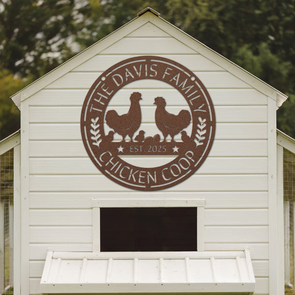 White chicken coop with 'The Davis Family Chicken Coop' logo on a wooden panel.