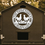 Chicken coop with 'The Davis Family Chicken Coop' logo on a wooden background