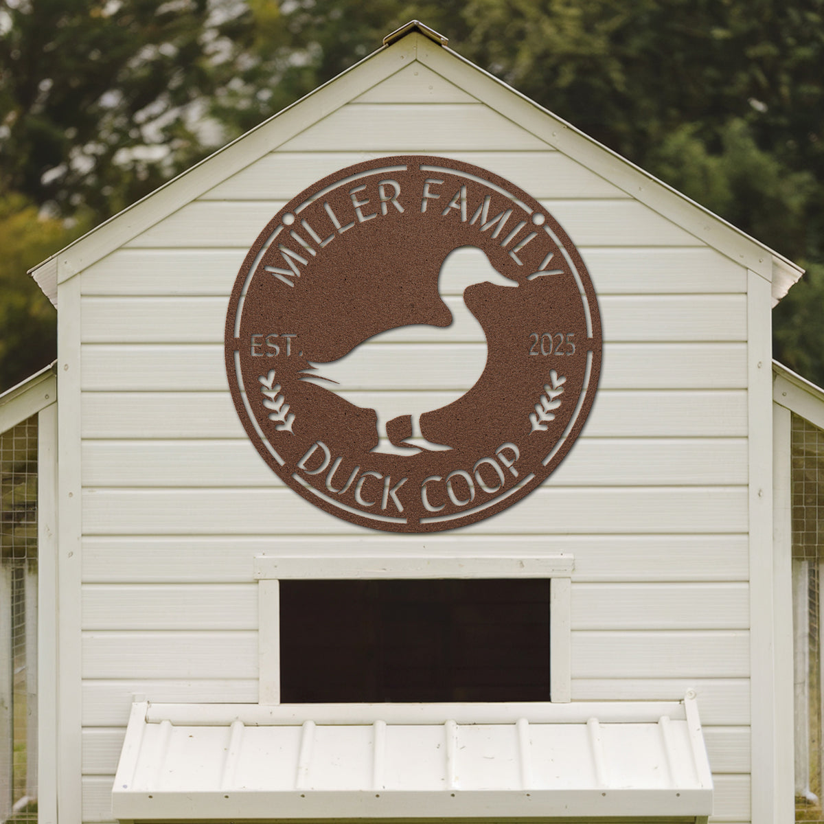 White duck coop with 'Miller Family Duck Coop' logo on a wooden background