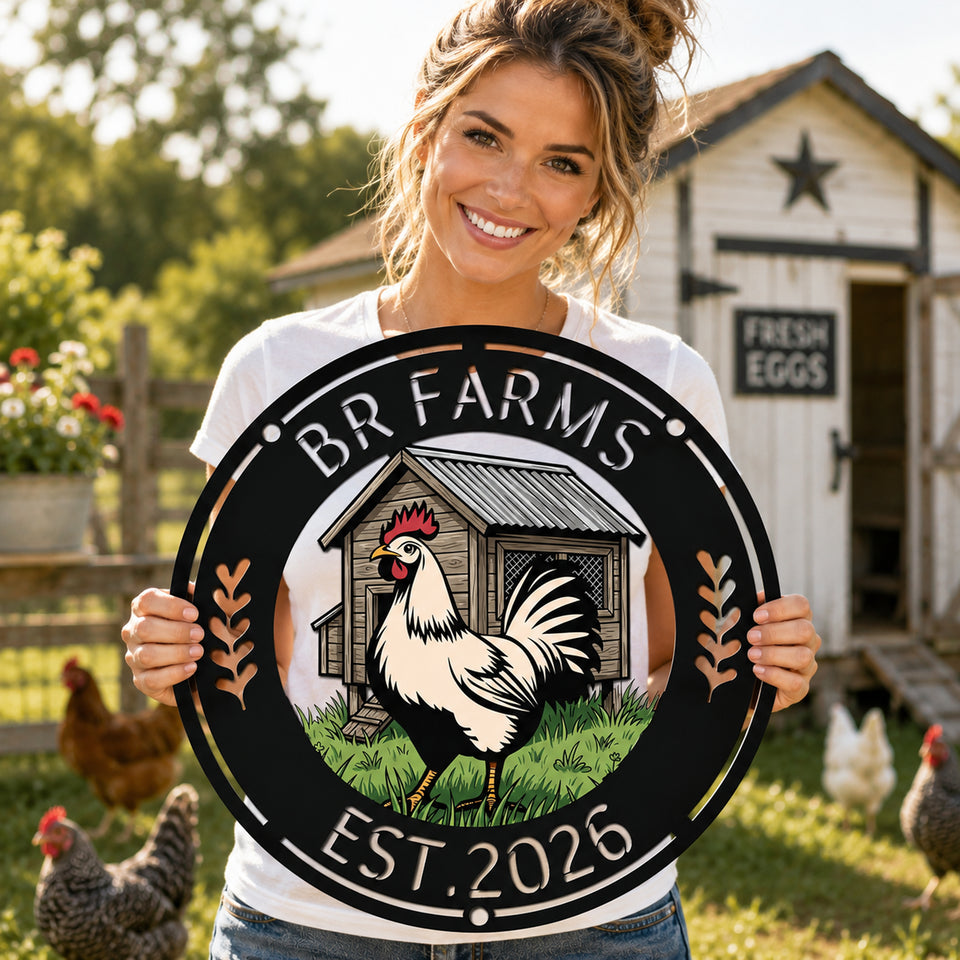 A smiling woman stands outdoors in a farmyard holding a large circular sign that reads “BR FARMS” and “EST. 2026,” with an illustration of a rooster and barn in the center.